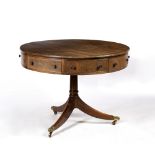 A GEORGIAN STYLE MAHOGANY CIRCULAR DRUM TABLE with four drawers and four faux drawers, all