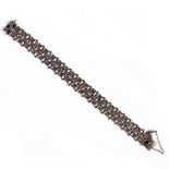 AN ARTICULATED WHITE METAL MARCASITE SET BRACELET each link stamped 'silver', 18.5cm long Condition: