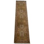 AN ORIENTAL HAND MADE WOOLLEN RUNNER with stylised decoration, 92cm x 350cm At present, there is