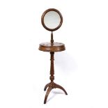 A VICTORIAN WALNUT SHAVING STAND with adjustable mirror and on tripod base, the circular central box