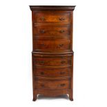 A MODERN MAHOGANY VENEERED GEORGIAN STYLE SMALL SIZE BOW FRONTED CHEST ON CHEST with six drawers and