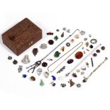 A SMALL JEWELLERY BOX containing various paste brooches, earrings and other items of jewellery At