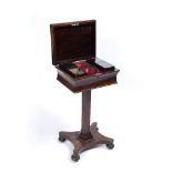 A VICTORIAN ROSEWOOD TEAPOY the fitted interior with four compartments, one with lid lacking, all