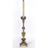 AN ITALIAN CARVED AND PAINTED GESSO AND GILTWOOD TORCHERE LAMP with three paw feet, 155cm in