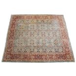 A MODERN ORIENTAL GREEN GROUND RUG with floral decoration and multiple banded border, 290cm x