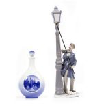 A ROYAL COPENHAGEN PORCELAIN DECANTER AND STOPPER decorated with a view of Rosenborg Castle, the