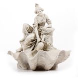 A ROYAL DUX PORCELAIN FIGURINE of a girl filling a water jug by a spring, all on a shell formed