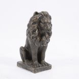 A COMPOSITE STONE SEATED LION 18cm wide x 23cm deep x 44cm high Condition: minor surface scratches