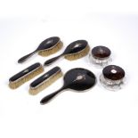 AN EARLY 20TH CENTURY SILVER MOUNTED TORTOISE SHELL DRESSING TABLE SET consisting of a hand mirror