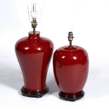 TWO RED GLAZED POTTERY TABLE LAMPS the largest 46cm in height Condition: no major damages, will need