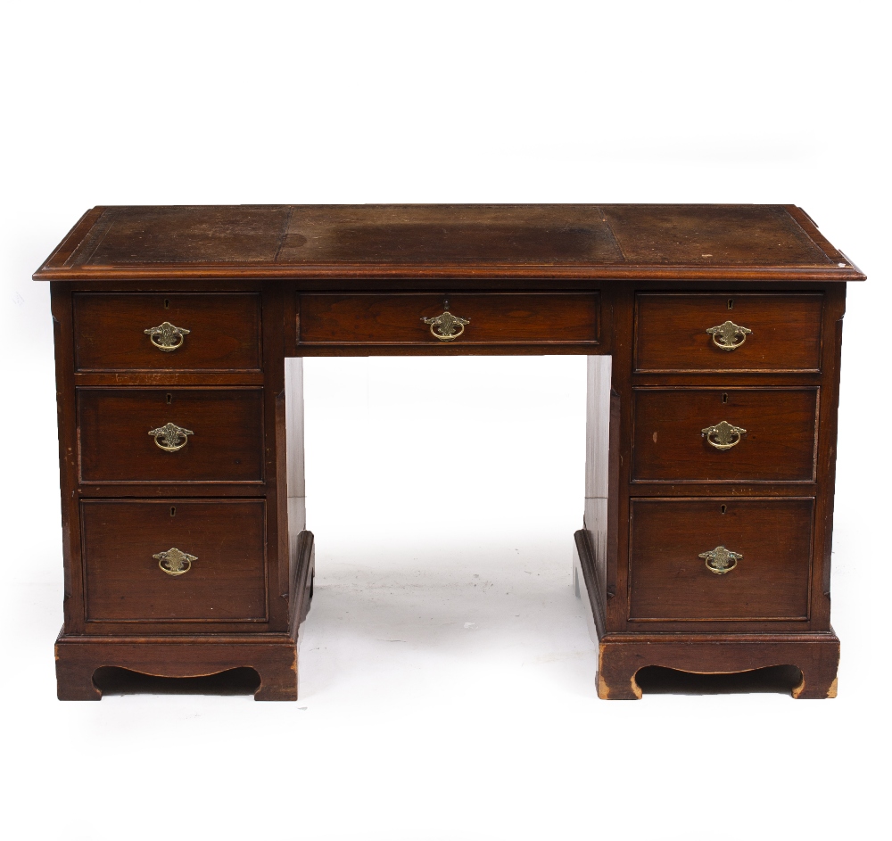 A GEORGIAN STYLE MAHOGANY PEDESTAL DESK the top with gilt tooled Morocco leather inset above one