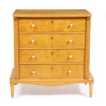 A CONTINENTAL SATIN BIRCH CHEST OF FOUR DRAWERS with faux ivory knob handles and raised on turned