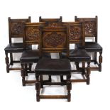 A SET OF SIX 17TH CENTURY STYLE OAK DINING CHAIRS circa 1920 with chip carved panel backs, leather