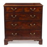 A GEORGE III MAHOGANY CHEST OF TWO SHORT AND THREE LONG DRAWERS with swan neck handles, all standing