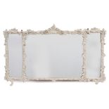 A 19TH CENTURY MIRROR the triple mirror plate surrounded by painted gesso moulded scrolling