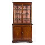 AN EDWARDIAN MAHOGANY AND SATINWOOD INLAID LIBRARY BOOKCASE CABINET with twin glazed doors above