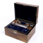 A VICTORIAN WALNUT LADIES TRAVELLING OR VANITY CASE with fitted interior, a mirror fitted within the