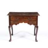 A GEORGE III OAK LOW BOY with walnut crossbanded decoration to the top and drawers, all on