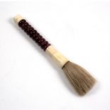 A LARGE CHINESE HARDSTONE CALLIGRAPHY BRUSH 38cm in length Condition: hairline crack to the bottom