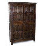 A LATE 19TH CENTURY 16TH CENTURY STYLE OAK CUPBOARD two pairs of panelled doors, 122cm wide x 38cm