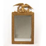 A 19TH CENTURY GILDED GESSO FRAMED RECTANGULAR WALL MIRROR with an eagle crest, 50.5cm wide x 94cm