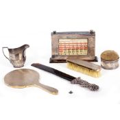A SILVER HANDLED VICTORIAN PAGE TURNER with tortoise shell blade, a silver mounted dressing table