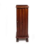 A MAHOGANY TALL NARROW BOW FRONTED BEDSIDE CABINET with fluted door and standing on paw front