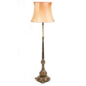 A VICTORIAN BRASS ADJUSTABLE LAMP STANDARD later converted for electric use with fluted column