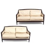 A PAIR OF CONTEMPORARY CREAM LEATHER UPHOLSTERED TWO SEATER SETTEES each 162cm wide x 85cm deep x