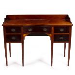 A MAHOGANY CONCAVE FRONTED SIDE OR DRESSING TABLE with cedar lined drawers and standing on square