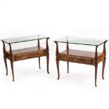 A PAIR OF CONTINENTAL BURR WALNUT VENEERED GLASS TOPPED OCCASIONAL TABLES each with single doors and