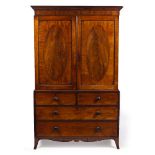 A 19TH CENTURY MAHOGANY LINEN PRESS with twin panelled doors above two short and two long drawers