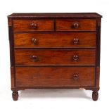 A VICTORIAN MAHOGANY CHEST OF TWO SHORT AND THREE LONG DRAWERS with turned knob handles and turned