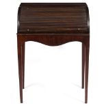 AN ANTIQUE MAHOGANY ROLL TOP DESK fitted with pigeon holes, drawers and a cupboard and adjustable