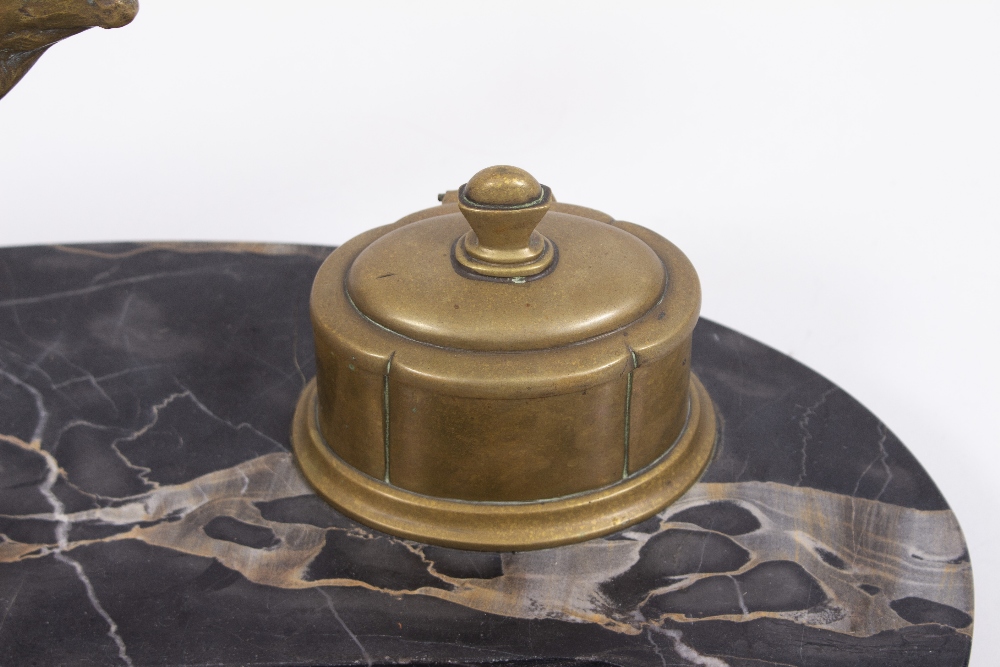A LATE 19TH / EARLY 20TH CENTURY BRASS STAG AND INKWELL DESK STAND with an oval black marble base, - Image 2 of 5