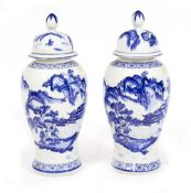 A PAIR OF MODERN CHINESE STYLE BLUE AND WHITE PORCELAIN VASES AND COVERS of baluster form, each 53cm