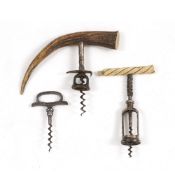 AN ANTIQUE IVORY HANDLED CORKSCREW 16cm in length; an antler handled corkscrew and a further antique