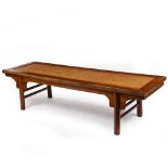 AN ORIENTAL HARDWOOD RECTANGULAR COFFEE TABLE with a rattan inset top, 205cm wide x 64cm deep x 52.