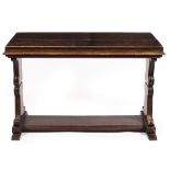 AN OAK FOLD OUT DINING TABLE with carved scrolling end supports and uniting stretcher, the top 122cm
