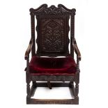 AN ANTIQUE CARVED OAK WAINSCOT CHAIR 60.5cm wide x 64cm deep x 112cm high Condition: later seat