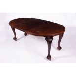 A 'D' END WIND OUT EXTENDING MAHOGANY DINING TABLE with carved cabriole legs and claw and ball feet,