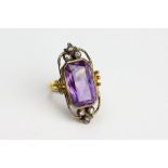 A LATE 19TH / EARLY 20TH CENTURY 9 CARAT GOLD BAGUETTE CUT AMETHYST AND WHITE STONE INSET RING
