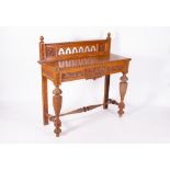 A LATE 19TH CENTURY GOTHIC STYLE OAK SIDE TABLE with a galleried back, single frieze drawer,