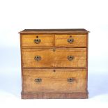 A 19TH CENTURY SATIN BIRCH SMALL SIZE CHEST OF TWO SHORT AND TWO LONG DRAWERS with later brass