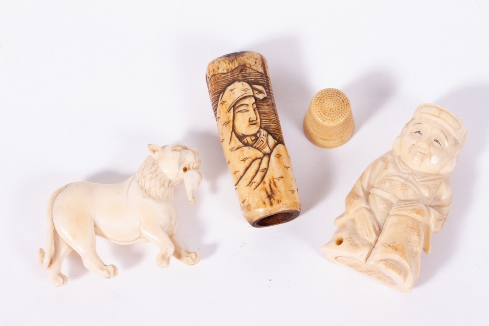 A 19TH CENTURY CARVED IVORY NETSUKE in the form of a kneeling man; a 19th century Oriental carved