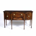 A GEORGIAN STYLE MAHOGANY BREAKFRONT SIDEBOARD circa 1970, with single drawer flanked by bowed