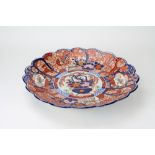 A LATE 19TH CENTURY JAPANESE IMARI CHARGER with a shaped border, 45.5cm diameter Condition: hairline