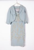 A VINTAGE BLUE DRESS embroidered in gold coloured thread and faux pearls Condition: some stains