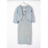 A VINTAGE BLUE DRESS embroidered in gold coloured thread and faux pearls Condition: some stains