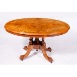 A VICTORIAN WALNUT LOO TABLE with satinwood inlaid decoration, turned supports and four cabriole